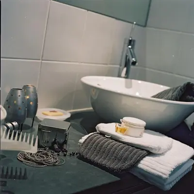 a bathroom with a sink and a counter with towels at Chambreplus Kriski in Ghent
