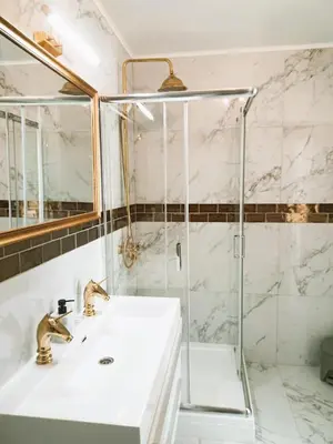 a bathroom with a sink and a shower at Logies Hanssen in Beveren