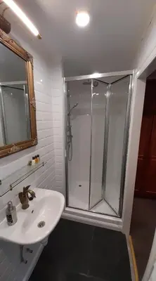 a bathroom with a shower and a sink at Bosdam Budget Rooms in Beveren