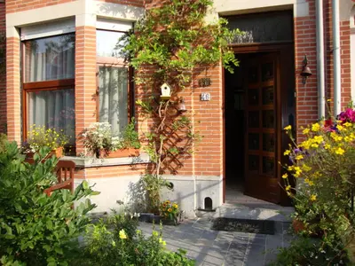 a house with flowers on the side of it at B&B Marianne in Brussels