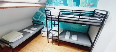 a small room with two bunk beds in it at KaBa Hostel in Ghent