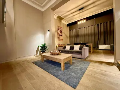 a living room with a couch and a coffee table at Luxury Suites Castel by Rikas Hotels in Antwerp