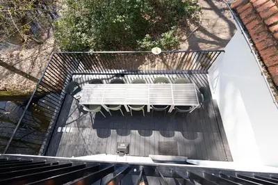 a group of chairs sitting on top of a building at Vakantiehuis Ochtendgloren in Turnhout