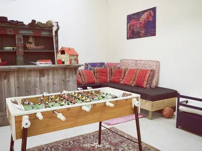 a living room with a table and a couch at De Lieshoeve in Arendonk