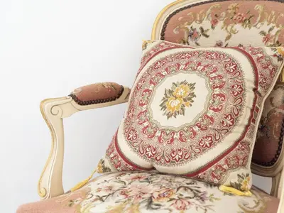 a chair with a pillow on top of it at De Lieshoeve in Arendonk