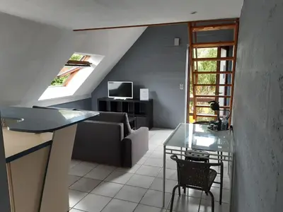 a living room with a couch and a table at Résidences De Champles in Bierges