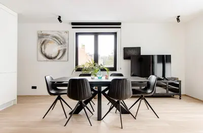 a dining room with a table and chairs at Résidence Palace Expo in Brussels