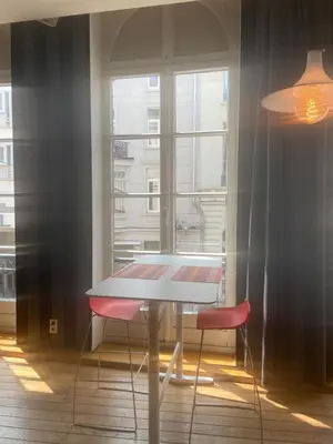a table and two chairs in a room with a window at Ghent Centre Croft Deluxe in Ghent