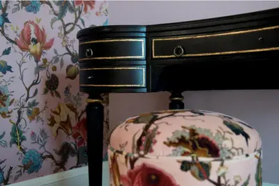 a dresser with a flower pattern on a wall at Villa Servais in Halle