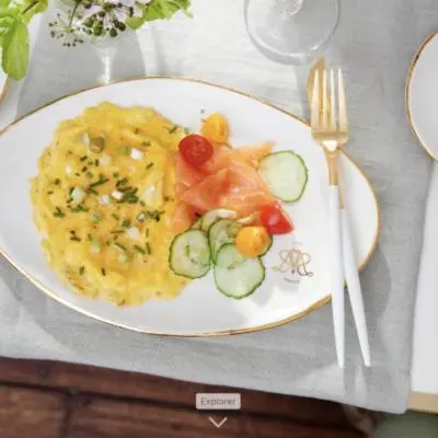 a plate of food with vegetables on a table at Villa Servais in Halle