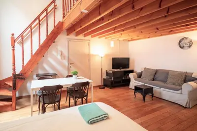 a living room with a couch and a table at Saint Paulus Square Apartments in Antwerp