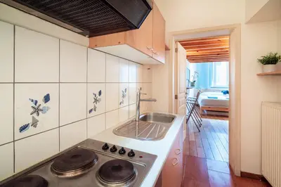 a kitchen with a sink and a stove at Saint Paulus Square Apartments in Antwerp
