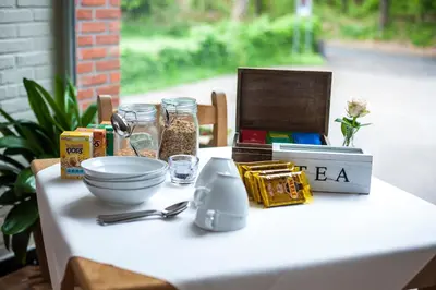 a table with food and other items on it at B&B De Meren in Aarschot