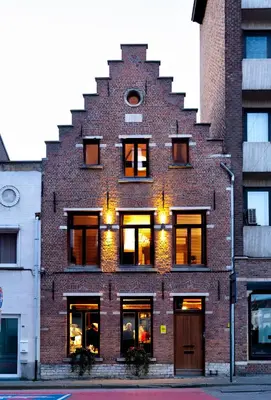 a red brick building with a spiral at B&B De Koepoort in Mechelen