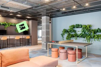 a conference room with a table and stools and a plant at Citybox Antwerp City Center in Antwerp