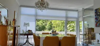 a dining room with a table and a large window at Magnifique appartement- Brussels expo Laeken in Brussels