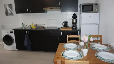 a kitchen with a table with plates on it at Roosevelt Apartments. in Antwerp
