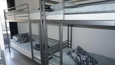 a couple of bunk beds in a room at Roosevelt Apartments. in Antwerp