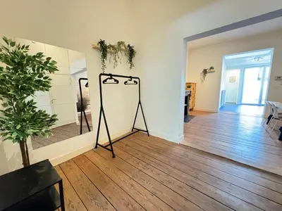 a room with a tripod in the middle of a room at Antwerp Old Town Centrum Apartment in Antwerp