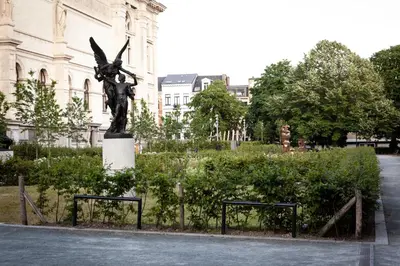 a statue of an angel in front of a building at Suite Aux Anges in Antwerp