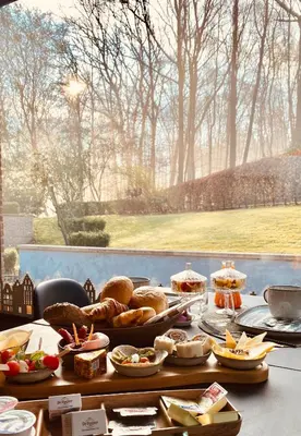 a table with bread and other food on it at B&B Miranoza in Oud-Heverlee