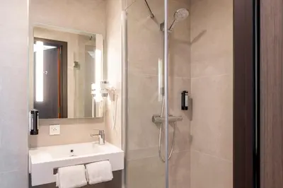 a bathroom with a shower and a sink at B&B HOTEL Antwerpen Centrum in Antwerp
