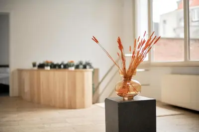 a vase sitting on a block in a room at BoLofts in Antwerp
