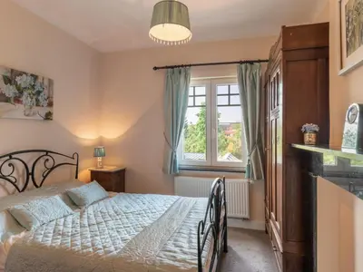 a bedroom with a bed and a window at Villa Jasmine by Interhome in Mol