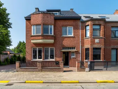a red brick building with a gate in front of it at Villa Jasmine by Interhome in Mol