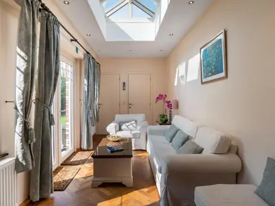 a living room with a couch and a skylight at Villa Jasmine by Interhome in Mol