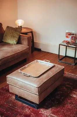 a living room with a couch and a coffee table at Duplex in historical centre with private courtyard in Antwerp