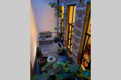 an overhead view of a room with a plant at Duplex in historical centre with private courtyard in Antwerp