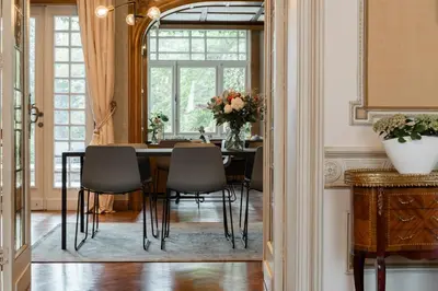 a dining room with a table and chairs at B&B Tannerie in Balen