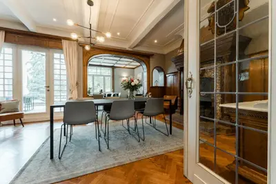 a dining room with a table and chairs at B&B Tannerie in Balen