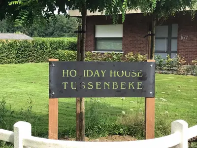 a sign in front of a house at Tussenbeke in Lede