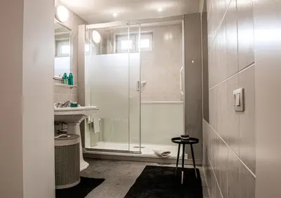 a bathroom with a shower and a sink at Huis Bertem in Bertem
