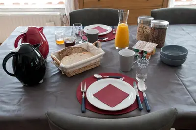 a table with plates of food on top of it at Wellintown Guest House in Waterloo