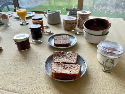 a table with two slices of bread on plates at Het Nekkerhof B&Bio in Mechelen