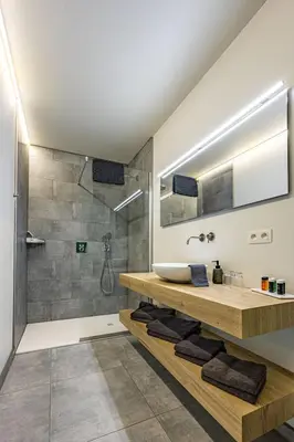 a bathroom with a sink and a shower at Bleekhoeve in Olen