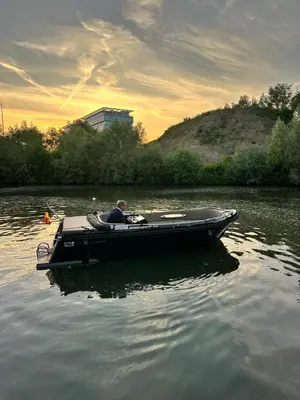 a man in a boat on the water at Lit de Clémot in Merelbeke