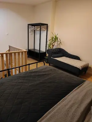 a bedroom with two beds and a mirror at Mica beauty & wellness center in Temse