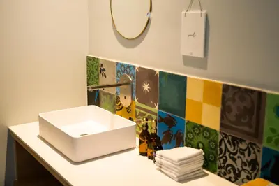 a bathroom with a sink and a mirror at Cire Bed and Breakfast in Meerhout