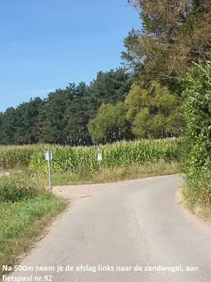 a road with a sign on the side of it at Eden in Sint-Pauwels