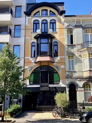 an apartment building with a balcony on a street at 3 Room Luxury Design Apartment with Airconditioning, Close to Gent St-Pieters Station in Ghent