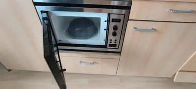 a microwave oven sitting inside of a kitchen at Cozy Apartment Brussels Centre in Brussels