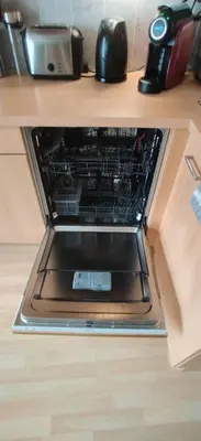 an oven with its door open in a kitchen at Cozy Apartment Brussels Centre in Brussels