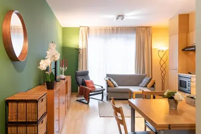 a living room with a couch and a table at Cozy Apartment Brussels Centre in Brussels