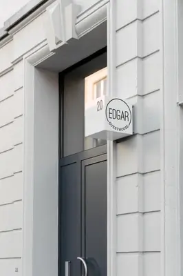a sign on a door of a building at Edgar Guesthouse in Ghent