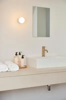 a bathroom counter with a sink and a mirror at Edgar Guesthouse in Ghent