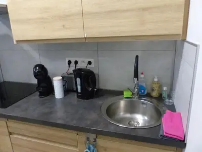 a kitchen counter top with a sink and a counter top at Superbe Studio au 1er étage, proche de la gare du Midi in Brussels